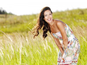 Young beautiful smiling woman outdoors