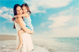 mom and daughter on beach