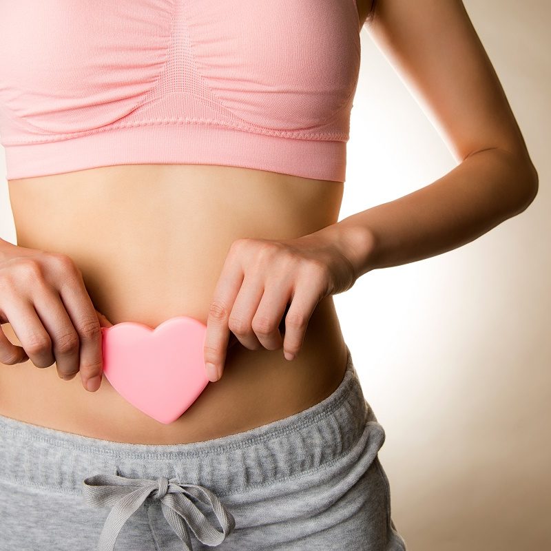 woman with heart over tummy