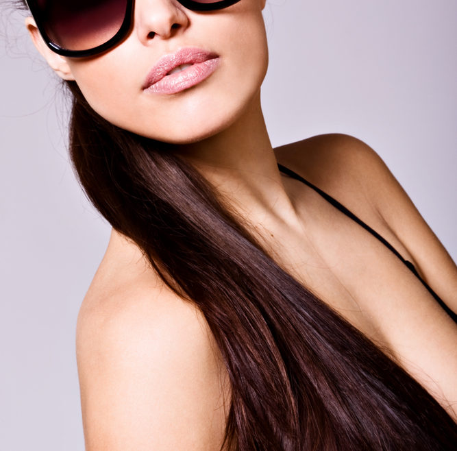 woman with long hair and sunglasses