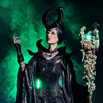 Woman wearing Maleficent costume.